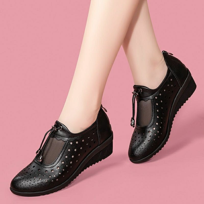 Sandalias de cuero con punta cerrada y tacón de cuña