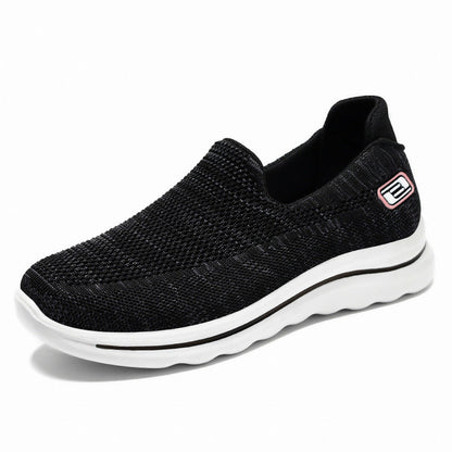 Los zapatos de las madres de mediana edad y ancianos pedalean zapatos de los ancianos con suelas planas, zapatos de las mujeres de la marca de fideos tejidos voladores con suelas suaves antideslizantes.