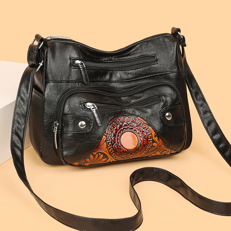 Bolso de piel con estampado de sol