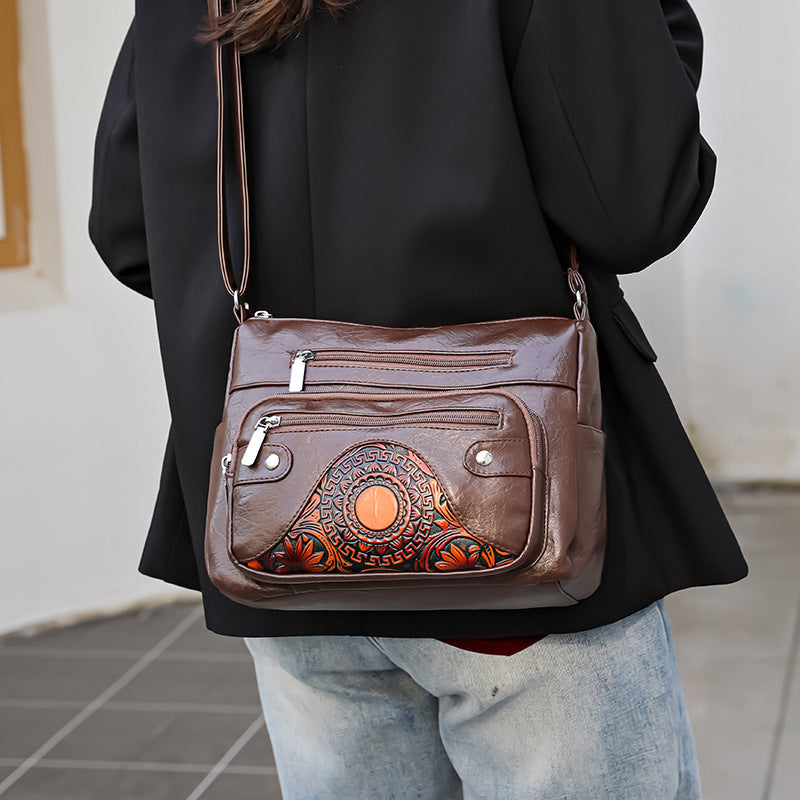 Bolso de piel con estampado de sol